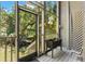 Outdoor screened in patio with greenery and beautiful views. Great for relaxing and enjoying the outdoors at 2033 Arbor Dr, Clearwater, FL 33760