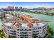 Elevated view of condo building featuring terracotta roofs, balconies and stunning water views at 205 Brightwater Dr # 101, Clearwater Beach, FL 33767