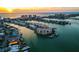 Panoramic aerial view of a condo building along the Intracoastal Waterway, complete with boat docks and stunning ocean views at 205 Brightwater Dr # 101, Clearwater Beach, FL 33767