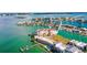 Aerial view showcases the waterfront condo complex in a prime location with boat docks at 205 Brightwater Dr # 101, Clearwater Beach, FL 33767