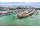 Coastal community view showcasing waterfront condos with docks and access to the Gulf of Mexico at 205 Brightwater Dr # 101, Clearwater Beach, FL 33767