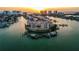 Beautiful aerial shot of waterfront condo building with private boat docks offering luxury living along the Intracoastal Waterway at 205 Brightwater Dr # 101, Clearwater Beach, FL 33767