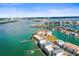 Aerial view featuring a waterfront condo community with private docks and boat lifts at 205 Brightwater Dr # 101, Clearwater Beach, FL 33767