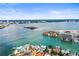 Expansive aerial view captures a waterfront community with a blend of residential homes and condo complexes at 205 Brightwater Dr # 101, Clearwater Beach, FL 33767