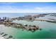 Breathtaking aerial view of the coastal community, highlighting the waterfront location and city skyline at 205 Brightwater Dr # 101, Clearwater Beach, FL 33767