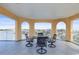 Enjoy the beautiful water views from this spacious balcony with outdoor dining set and beautiful arched entries at 205 Brightwater Dr # 101, Clearwater Beach, FL 33767