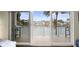 Balcony view featuring seating and a waterway view of neighboring houses at 205 Brightwater Dr # 101, Clearwater Beach, FL 33767