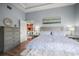 Comfortable bedroom offers a large bed, dresser, water-themed decor, and access to the rest of the house at 205 Brightwater Dr # 101, Clearwater Beach, FL 33767