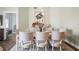 Elegant dining room boasts stylish furnishings, a chic rug, and modern lighting fixture, perfect for entertaining at 205 Brightwater Dr # 101, Clearwater Beach, FL 33767