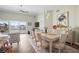 Bright dining room with water views, vaulted ceilings, and elegant furnishings at 205 Brightwater Dr # 101, Clearwater Beach, FL 33767