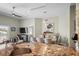 The dining room and kitchen have views of the water with hardwood floors, natural light and stainless steel sink at 205 Brightwater Dr # 101, Clearwater Beach, FL 33767