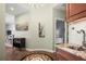 Stylish entryway featuring wood floors, a wet bar, and elegant coastal decor at 205 Brightwater Dr # 101, Clearwater Beach, FL 33767