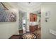 Inviting foyer boasts a stylish wet bar, unique lighting, and views into adjacent rooms at 205 Brightwater Dr # 101, Clearwater Beach, FL 33767