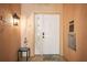 Inviting front door with modern decor and welcoming flamingo themed accents at 205 Brightwater Dr # 101, Clearwater Beach, FL 33767