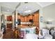 Open kitchen boasts a granite island with seating, stainless steel appliances, wood cabinets and a skylight at 205 Brightwater Dr # 101, Clearwater Beach, FL 33767