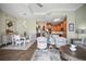 Open concept living and dining area with stylish furniture and an open-concept kitchen at 205 Brightwater Dr # 101, Clearwater Beach, FL 33767