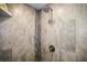 Walk-in shower featuring designer tile accents and a modern shower head at 205 Brightwater Dr # 101, Clearwater Beach, FL 33767