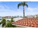 Stunning water view from roof features a skyline, beautiful canal, palm trees, and blue skies at 205 Brightwater Dr # 101, Clearwater Beach, FL 33767