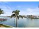 Expansive water views featuring docks and palm trees from this waterfront property at 205 Brightwater Dr # 101, Clearwater Beach, FL 33767
