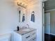 Bright bathroom features a modern vanity with granite countertop and brushed nickel fixtures at 207 W Chelsea St, Tampa, FL 33603