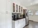 Bright kitchen featuring stainless steel appliances, black granite countertops, and white cabinetry at 207 W Chelsea St, Tampa, FL 33603