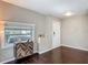 Cozy living room with dark wood floors, a large window for natural light and stylish cabinet at 207 W Chelsea St, Tampa, FL 33603