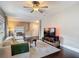 Bright living room with hardwood floors and an open layout, seamlessly connecting to other living spaces at 207 W Chelsea St, Tampa, FL 33603
