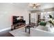 Well-lit living room flows into the dining area, featuring hardwood floors and modern decor at 207 W Chelsea St, Tampa, FL 33603