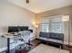 Bright home office with dark floors, comfortable seating, modern desk and computers at 207 W Chelsea St, Tampa, FL 33603