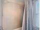 Modern bathroom shower featuring sleek neutral-toned tile and contemporary fixtures at 207 W Chelsea St, Tampa, FL 33603
