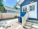 Side yard of home with steps up to an entrance and adjacent parking area at 207 W Chelsea St, Tampa, FL 33603