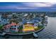 Stunning waterfront home features modern design, private dock, and beautiful landscaping with expansive water views at 2087 Michigan Ne Ave, St Petersburg, FL 33703