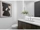 Contemporary powder room featuring a floating vanity, stylish artwork, and a sleek, modern design at 2087 Michigan Ne Ave, St Petersburg, FL 33703