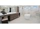 Spa-like bathroom with a soaking tub, walk-in shower, and modern vanity at 2087 Michigan Ne Ave, St Petersburg, FL 33703