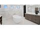 Beautiful bathroom featuring a soaking tub, walk-in shower, and modern vanity at 2087 Michigan Ne Ave, St Petersburg, FL 33703