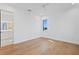 Bright bedroom featuring a small window, hardwood floors, and white walls at 2087 Michigan Ne Ave, St Petersburg, FL 33703