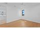 Bright bedroom featuring a small window, hardwood floors, and white walls at 2087 Michigan Ne Ave, St Petersburg, FL 33703