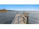 Wooden dock stretching out into the water, offering direct water access at 2087 Michigan Ne Ave, St Petersburg, FL 33703