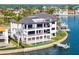 Stunning waterfront home with multiple balconies, a private pool, and a boat dock, offering luxurious coastal living at 2087 Michigan Ne Ave, St Petersburg, FL 33703