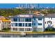 Expansive waterfront home with a modern design, featuring balconies, and a private dock for waterfront enjoyment at 2087 Michigan Ne Ave, St Petersburg, FL 33703