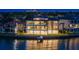 Striking three-story waterfront house featuring a sleek design, expansive windows, and serene water views at 2087 Michigan Ne Ave, St Petersburg, FL 33703