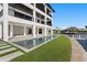 Luxury waterfront home with a modern design, featuring a pool, multiple balconies, and a private dock at 2087 Michigan Ne Ave, St Petersburg, FL 33703