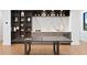 Entertaining game room with a modern bar area, built-in shelving, and a ping pong table for recreation at 2087 Michigan Ne Ave, St Petersburg, FL 33703