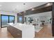 Open kitchen with an island that connects to a living area and offers stunning waterfront views at 2087 Michigan Ne Ave, St Petersburg, FL 33703