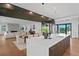 Spacious open-concept kitchen flowing into the living room, featuring a large island and modern design at 2087 Michigan Ne Ave, St Petersburg, FL 33703