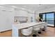 Modern kitchen with stainless steel appliances, an island with bar seating, and access to outdoor grill at 2087 Michigan Ne Ave, St Petersburg, FL 33703