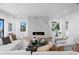 Bright and airy living room with modern fireplace, hardwood floors, and stylish seating at 2087 Michigan Ne Ave, St Petersburg, FL 33703
