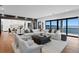 Spacious living room with ocean views, hardwood floors, an open floor plan, and modern decor at 2087 Michigan Ne Ave, St Petersburg, FL 33703