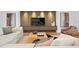 Inviting living room featuring a modern fireplace with wooden paneling and comfortable seating arrangement at 2087 Michigan Ne Ave, St Petersburg, FL 33703