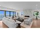 Bright living room with ocean view, modern fireplace, hardwood floors and comfortable seating at 2087 Michigan Ne Ave, St Petersburg, FL 33703